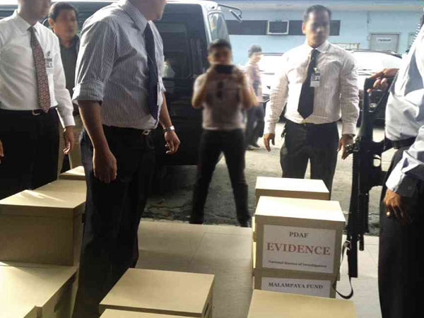 Inquirere photo and report: On Wednesday afternoon, 15 boxes of evidence and more than 2,000 pages of financial transactions purportedly detailing the extent of a P10-billion racket involving state funds meant to ease rural poverty and ended in kickbacks over 10 years were submitted to the National Bureau of Investigation. The evidence that could implicate the senators—principally endorsements of questionable nongovernment organizations (NGOs)—would come from official records, according to a source who is privy to the investigations. “The smoking gun that could pin down the senators comes from government agencies where these letters were sent,” said the source who talked to the Inquirer on condition of anonymity.